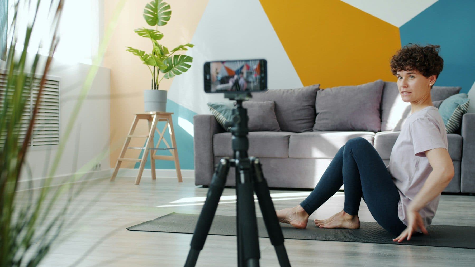 Creator recording a video with a phone on a tripod